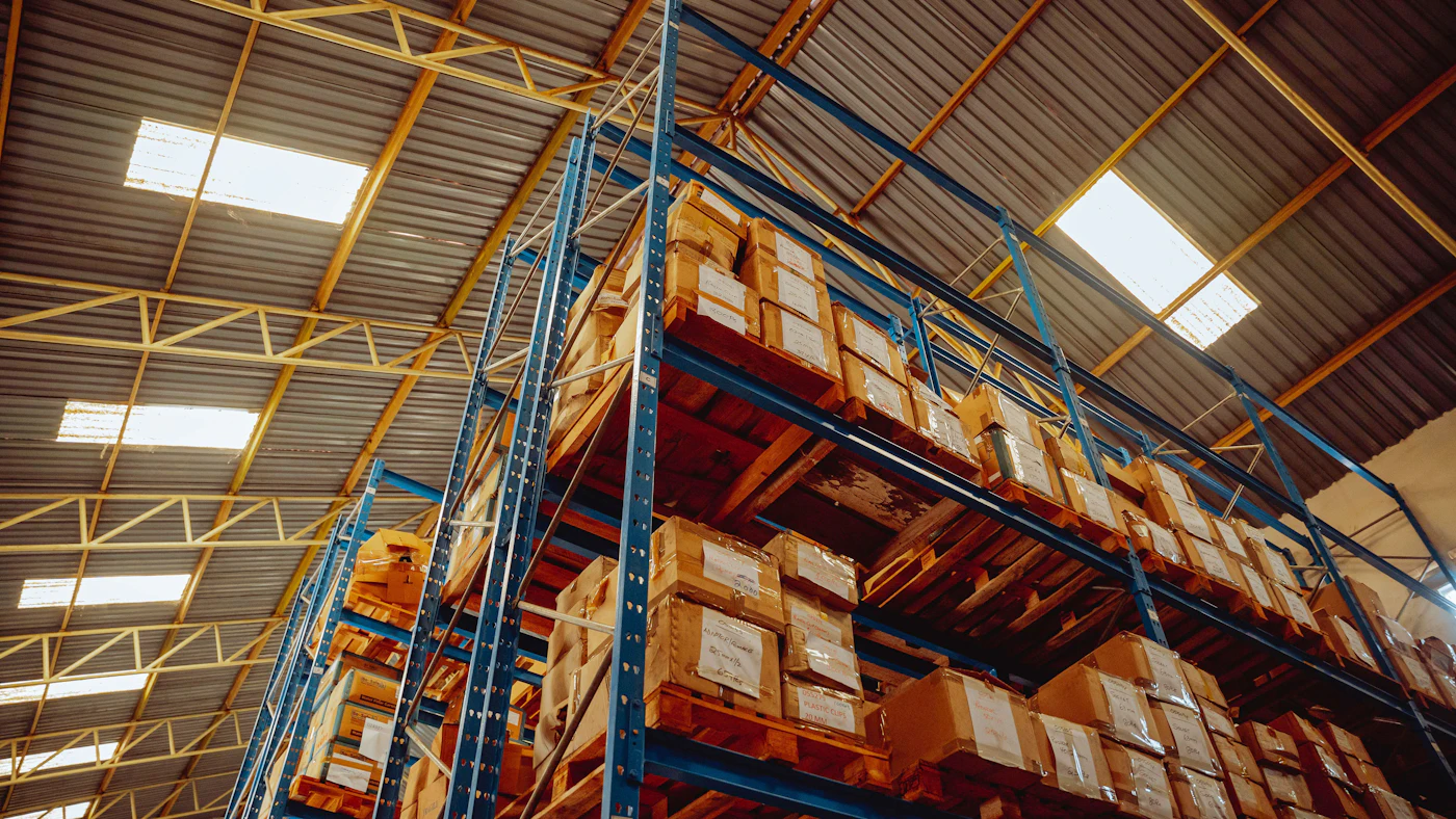 Cased goods stacked high on warehouse racking